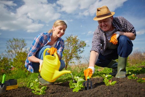 Worker wearing PPE while carrying out landscaping tasks